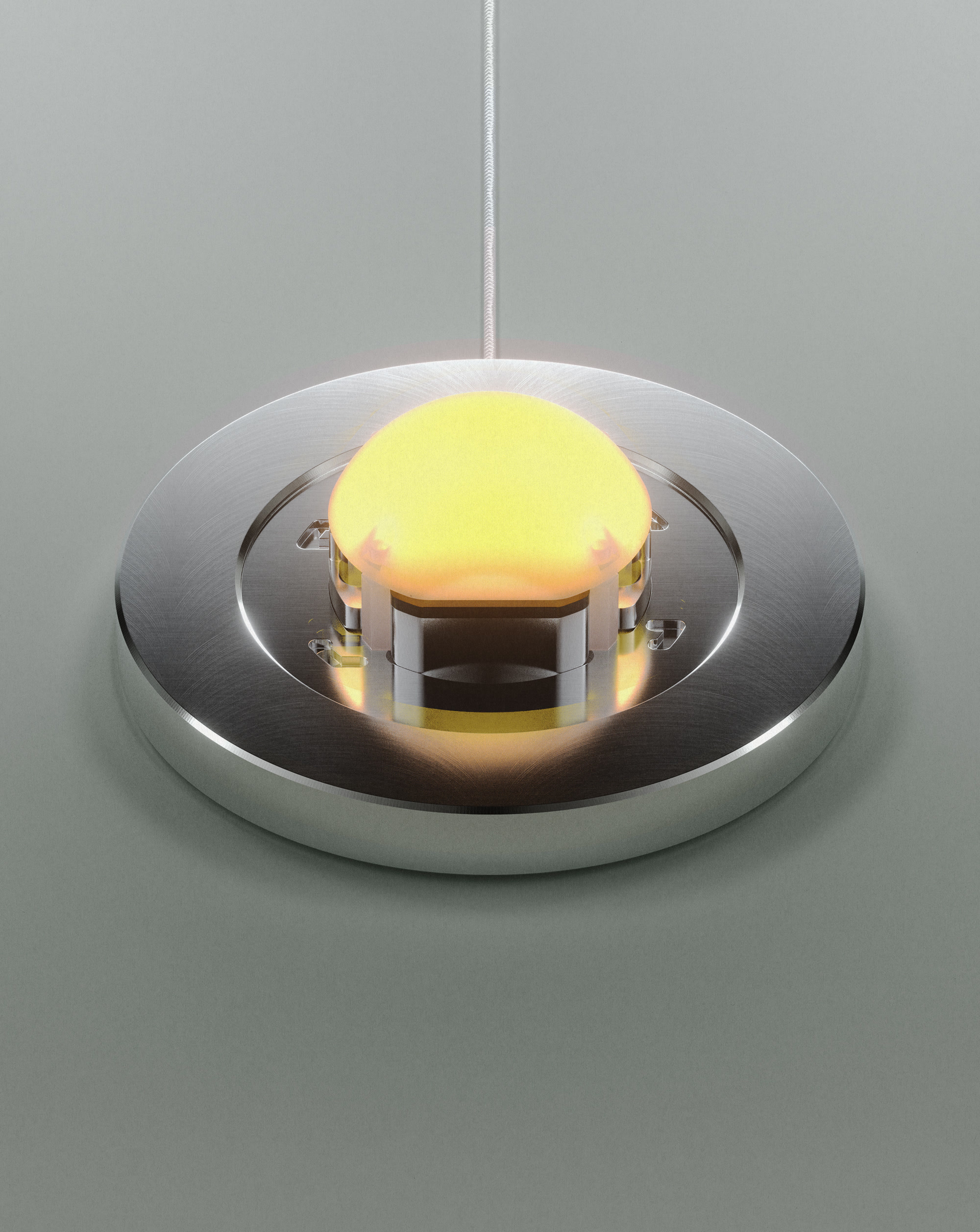 A profile shot of EP01's all aluminum base, with a soft orange glow emitting from a diffusion dome.