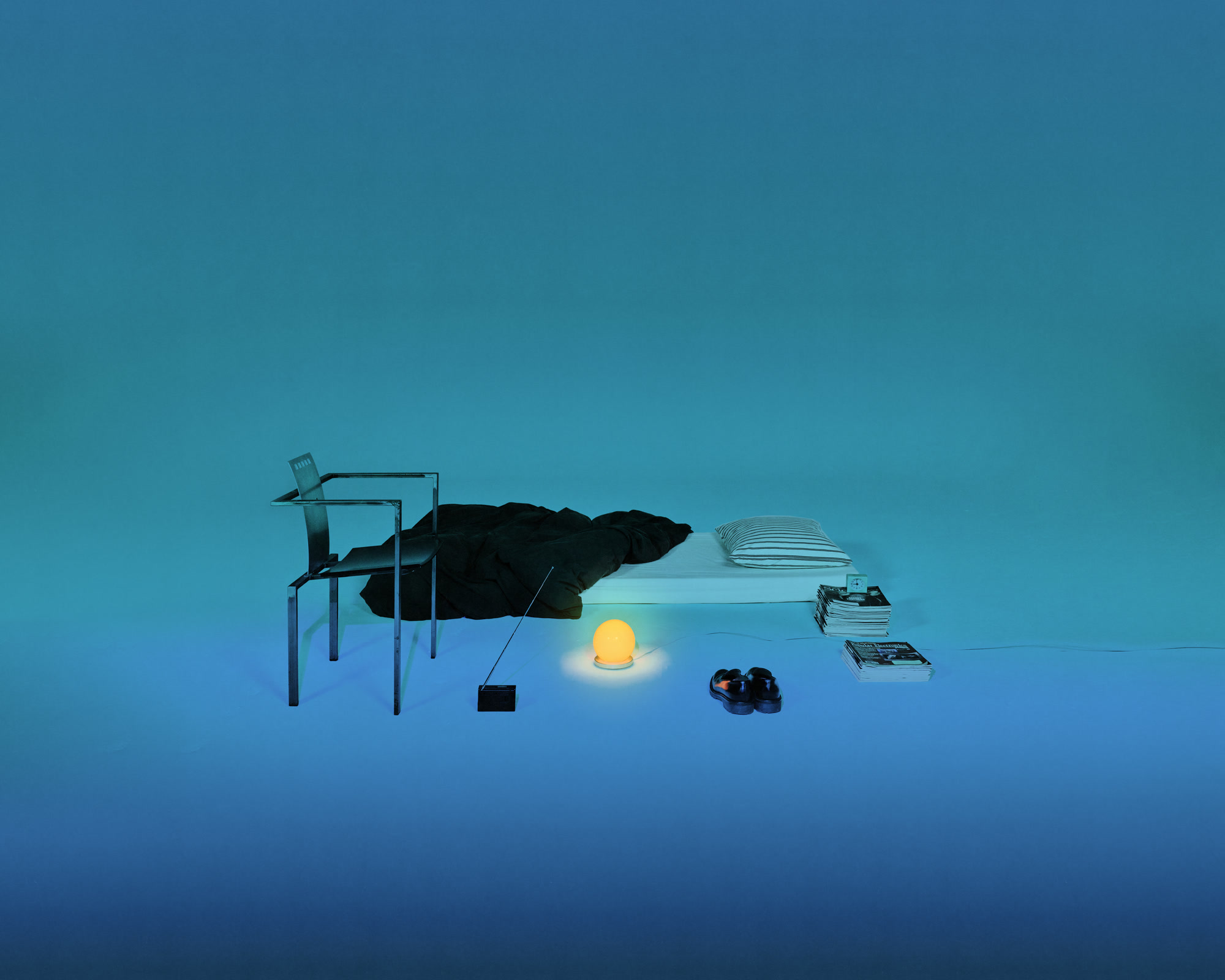 EP01 illuminating a deconstructed bedroom in an ethereal blue landscape.